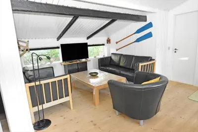 a living room with a couch and a table at 1321-Thisted-Blamunkevej-58 in Thisted