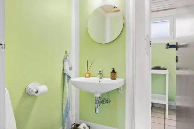a bathroom with a sink and a mirror at 269-Vestervig-Blishonevej-19 in Vestervig