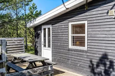 a picnic table in front of a tiny house at 286-Thisted-Blamunkevej-49 in Thisted
