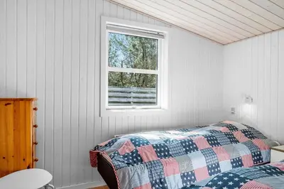 a bedroom with a bed and a window at 286-Thisted-Blamunkevej-49 in Thisted