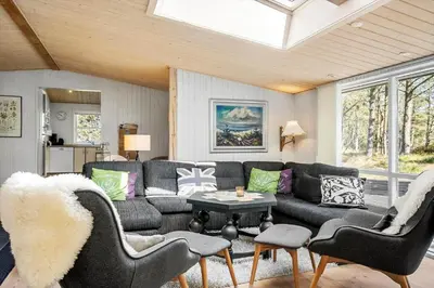 a living room with a couch and a table at 286-Thisted-Blamunkevej-49 in Thisted
