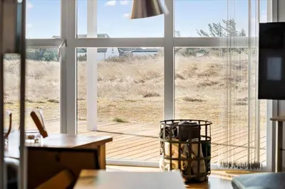 a room with a large window with a view of a deck at 497-Thisted-Nordsovej-26 in Thisted