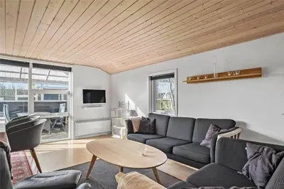 a living room with a couch and a table at 505-Thisted-Fiskervej-50-A in Thisted