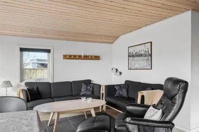 a living room with a couch and a table at 505-Thisted-Fiskervej-50-A in Thisted