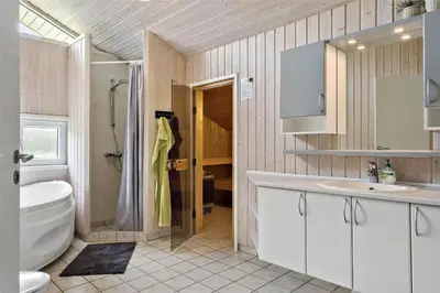 a bathroom with a sink and a toilet and a shower at 233-Thisted-Tunvej-5 in Thisted