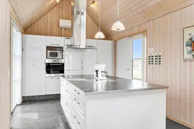 a kitchen with white cabinets and a counter top at 262-Vestervig-Magevej-15 in Vestervig
