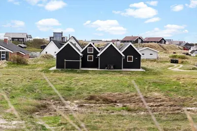 a row of black houses in a field with houses at 262-Vestervig-Magevej-15 in Vestervig
