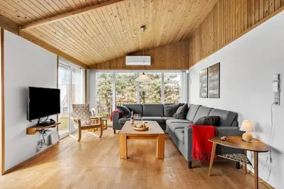 a living room with a couch and a table at 806-Thisted-Nordsovej-39 in Thisted