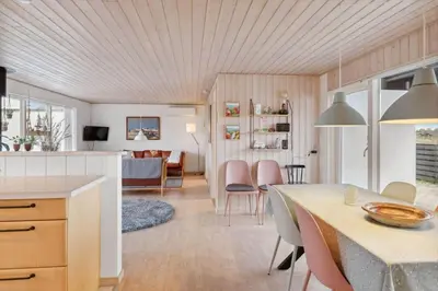 a kitchen and living room with a table and chairs at 699-Thisted-Sotungevej-33 in Thisted