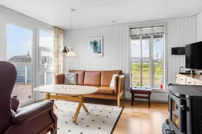 a living room with a couch and a table at 809-Thisted-Aerenprisvej-11 in Thisted