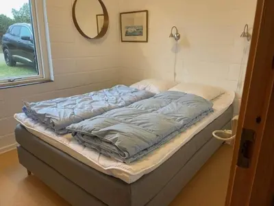 a large bed in a room with a window at 426-Thisted-Havbovej-26 in Thisted