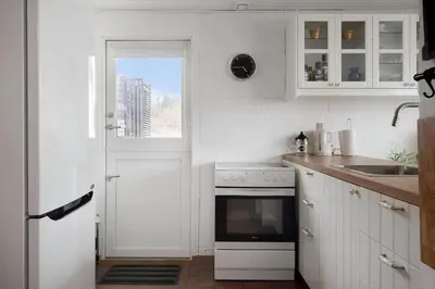 a white kitchen with a sink and a stove at 426-Thisted-Havbovej-26 in Thisted