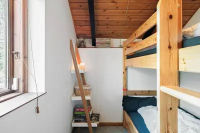 a room with two bunk beds and a ladder at 510-Thisted-Egebaksandevej-10 in Thisted