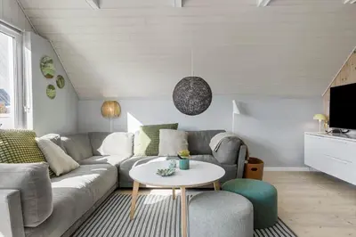 a living room with a couch and a table at 326-Thisted-Kristinesvej-24 in Thisted