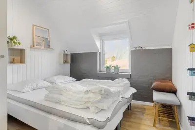 a bedroom with a large white bed with a window at 326-Thisted-Kristinesvej-24 in Thisted