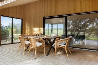 a dining room with a wooden table and chairs at 113-Thisted-Muslingevej-13-D in Thisted