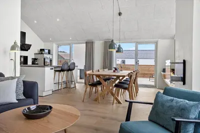 a kitchen and living room with a table and chairs at 667-Thisted-Smedevej-3-C in Thisted