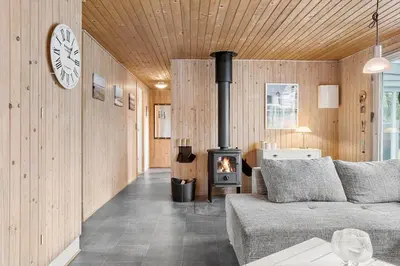 a living room with a couch and a stove at 317-Thisted-Molgaardsvej-65 in Thisted
