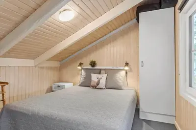 a bedroom with a large bed in a room at 772-Thisted-Hummervej-6 in Thisted