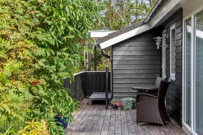 a patio with two chairs and a bench on a house at 712-Vestervig-Kanalvej-12 in Vestervig