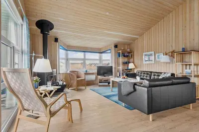 a living room with a couch and a table at 947-Thisted-Niels-Vognmands-Vej-20 in Torsted