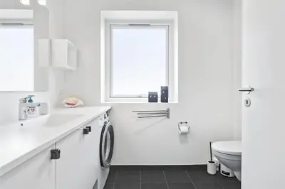 a white bathroom with a sink and a toilet at 793-Thisted-Havstokken-24-1 in Thisted