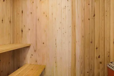 a wooden wall with a wooden shelf in a sauna at 867-Thisted-Nordsovej-66 in Thisted