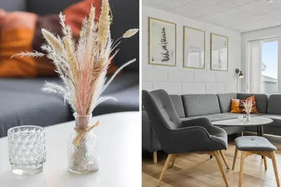 a living room with a couch and a table with a vase at 867-Thisted-Nordsovej-66 in Thisted
