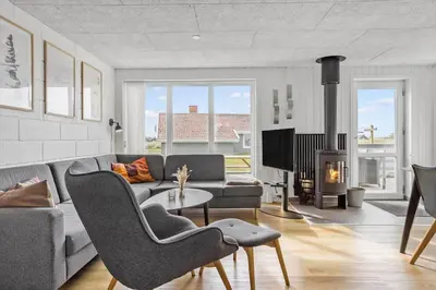 a living room with a couch and a fireplace at 867-Thisted-Nordsovej-66 in Thisted