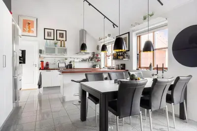 a kitchen and dining room with a table and chairs at 496-Snedsted-Niels-Juels-Vej-33 in Snedsted