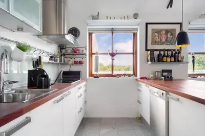 a white kitchen with a sink and a window at 496-Snedsted-Niels-Juels-Vej-33 in Snedsted