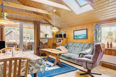 a living room with a couch and a table at 749-Thisted-Nordsovej-214 in Thisted