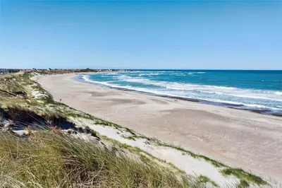a sandy beach with the ocean in the background at 917-Thisted-Kobbelsti-46 in Torsted