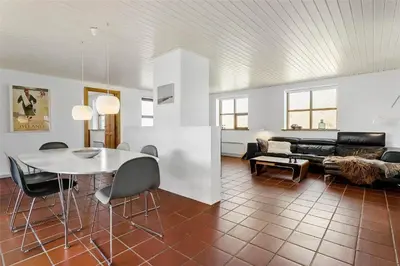 a living room with a table and a couch at 917-Thisted-Kobbelsti-46 in Torsted