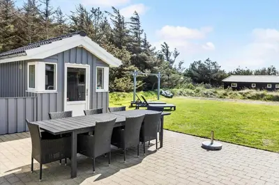 a patio with a table and chairs and a shed at 709-Thisted-Muslingevej-2 in Thisted