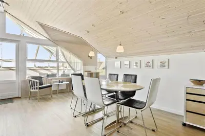 a dining room with a table and chairs at 807-Thisted-Grarisvej-13 in Thisted