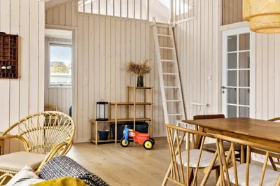 a room with a table and a toy car in it at 192-Snedsted-Sarasvej-12 in Snedsted