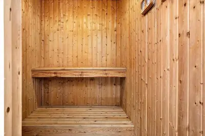 a wooden sauna with a wooden bench in it at 219-Thisted-Fiskervej-16 in Thisted