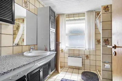 a bathroom with a sink and a window at 219-Thisted-Fiskervej-16 in Thisted