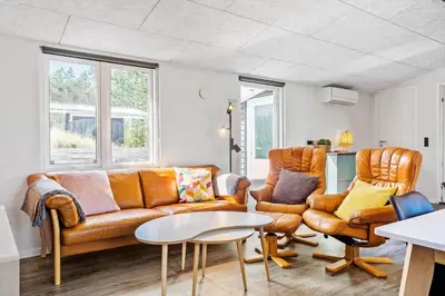 a living room with a couch and two chairs at 511-Thisted-Blabaervej-16 in Thisted