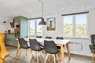 a kitchen and dining room with a table and chairs at 511-Thisted-Blabaervej-16 in Thisted