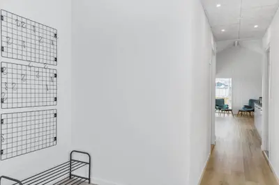 a room with a white wall and a metal bench at 167-Thisted-Vesterhavsgade-158 in Thisted