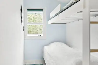 a white room with a bed and a window at 645-Thisted-Blabaervej-4 in Thisted