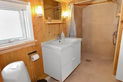 a bathroom with a white sink and a shower at 504-Thisted-Nordsovej-206-C in Thisted