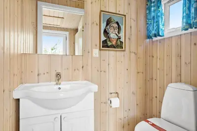 a bathroom with a white sink and a toilet at 916-Thisted-Spanggardsvej-59 in Torsted