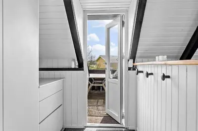 a kitchen with a door leading to a balcony at 1007-Thisted-Mombak-7 in Torsted