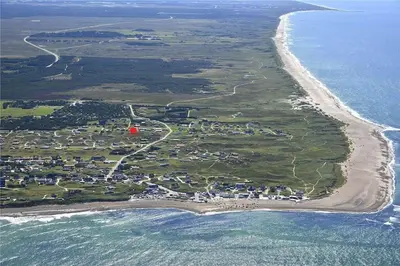 an aerial view of a small island in the ocean at 1007-Thisted-Mombak-7 in Torsted