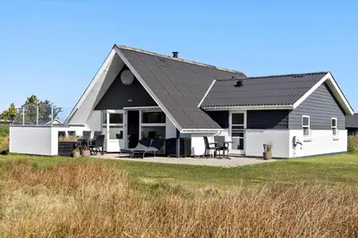 a white house with a black roof at 332-Thisted-Kristinesvej-32 in Thisted
