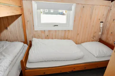 a small bedroom with a bed and a window at 829-Thisted-Nordsovej-188 in Thisted