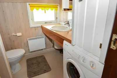 a small bathroom with a washing machine and a sink at 829-Thisted-Nordsovej-188 in Thisted